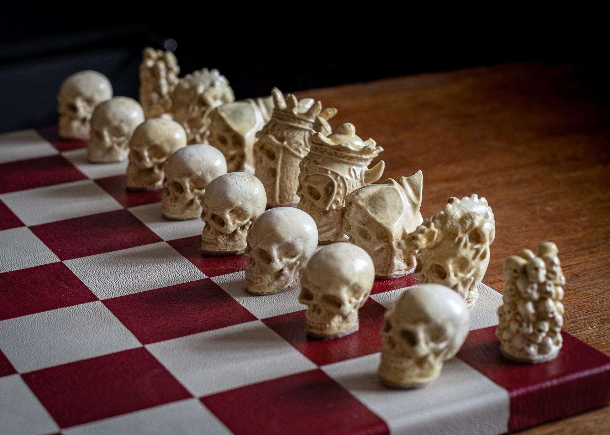 Made to order – Chess set, Skulls design in stone and aged red colour. BOARD NOT INCULDED