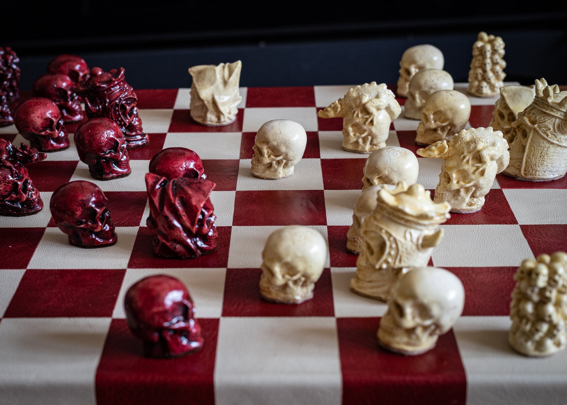 Made to order – Chess set, Skulls design in stone and aged red colour. BOARD NOT INCULDED