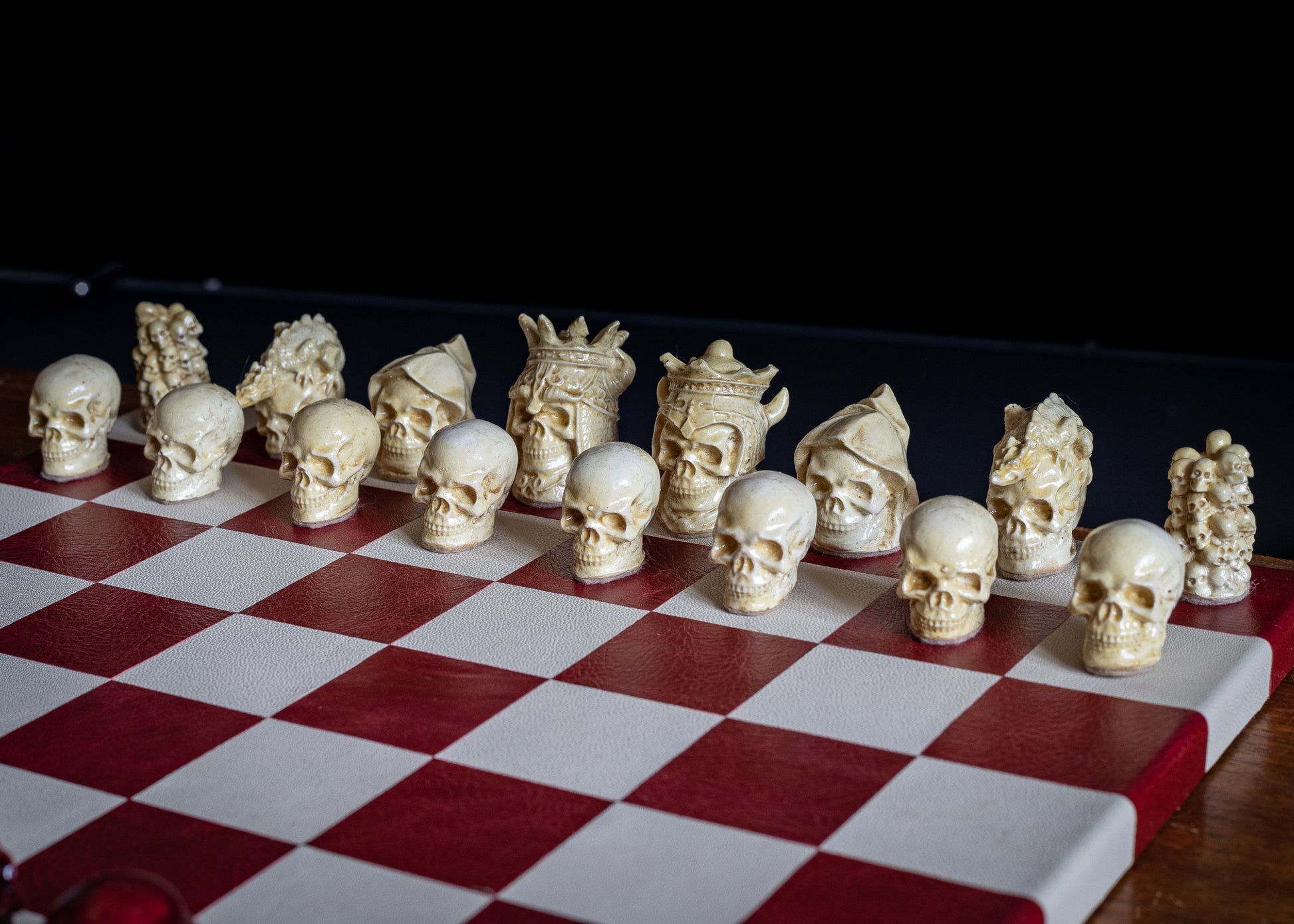 Made to order – Chess set, Skulls design in stone and aged red colour. BOARD NOT INCULDED