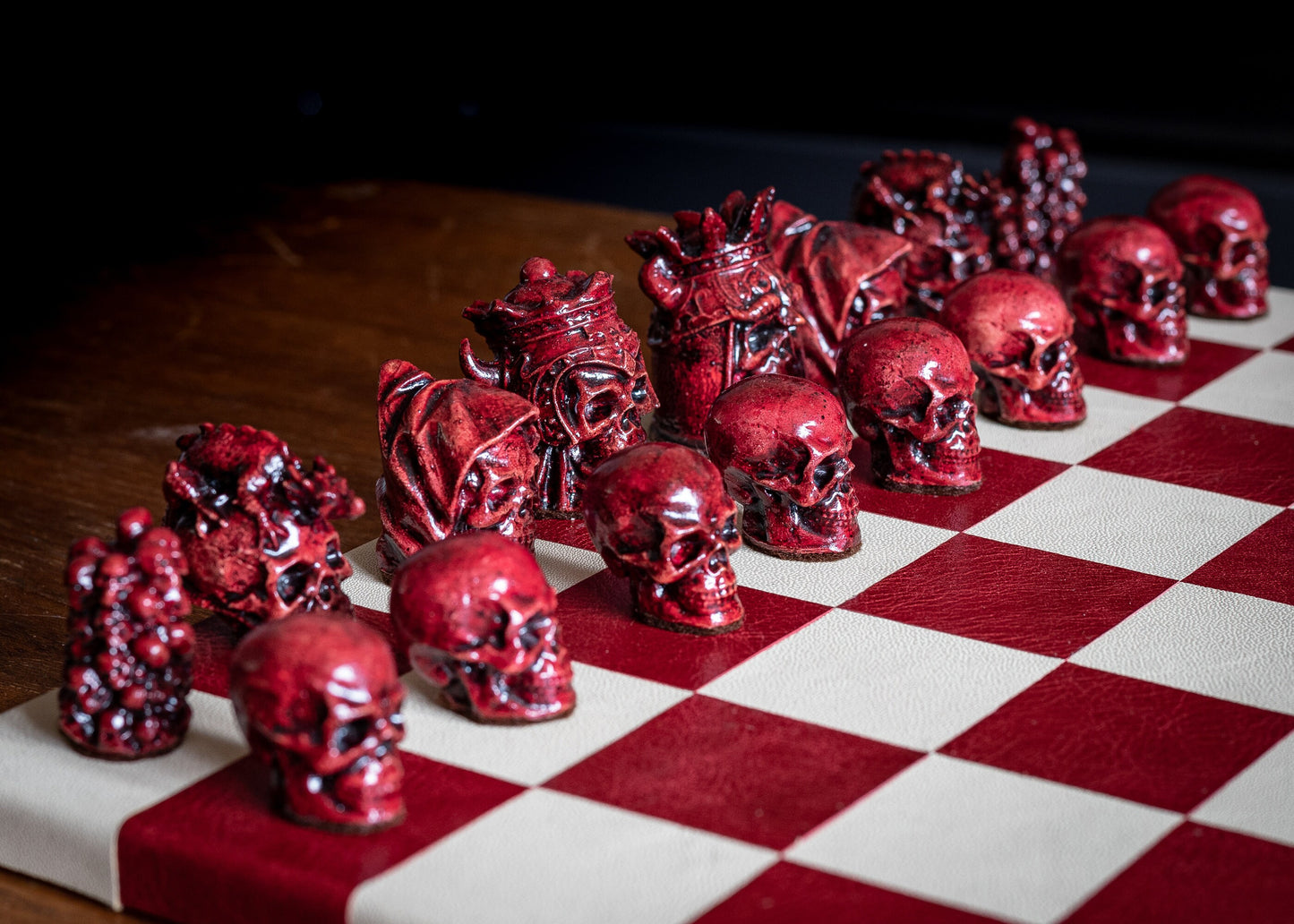 Made to order – Chess set, Skulls design in stone and aged red colour. BOARD NOT INCULDED