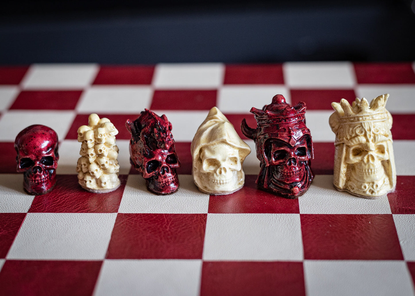 Made to order – Chess set, Skulls design in stone and aged red colour. BOARD NOT INCULDED