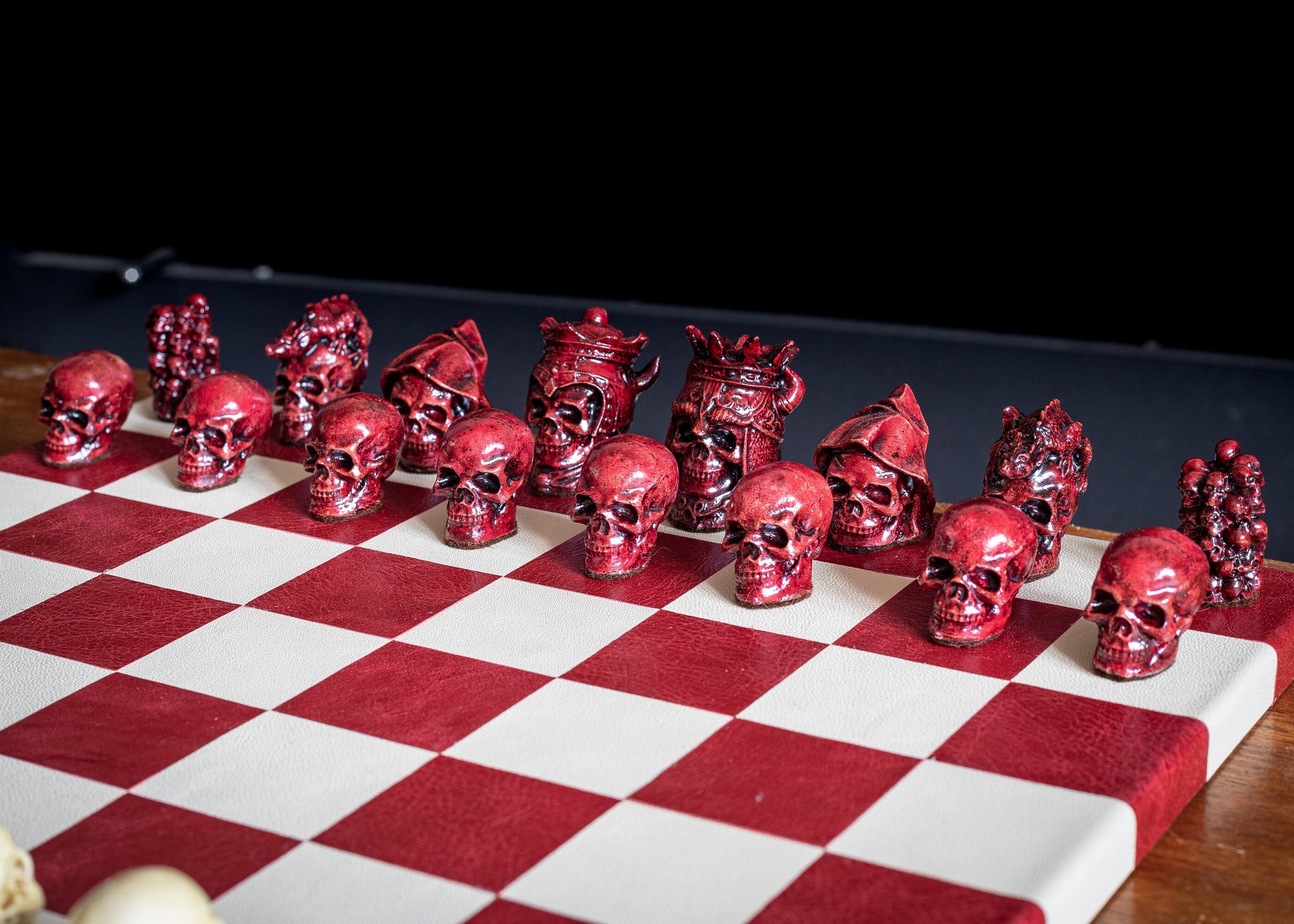 Made to order – Chess set, Skulls design in stone and aged red colour. BOARD NOT INCULDED