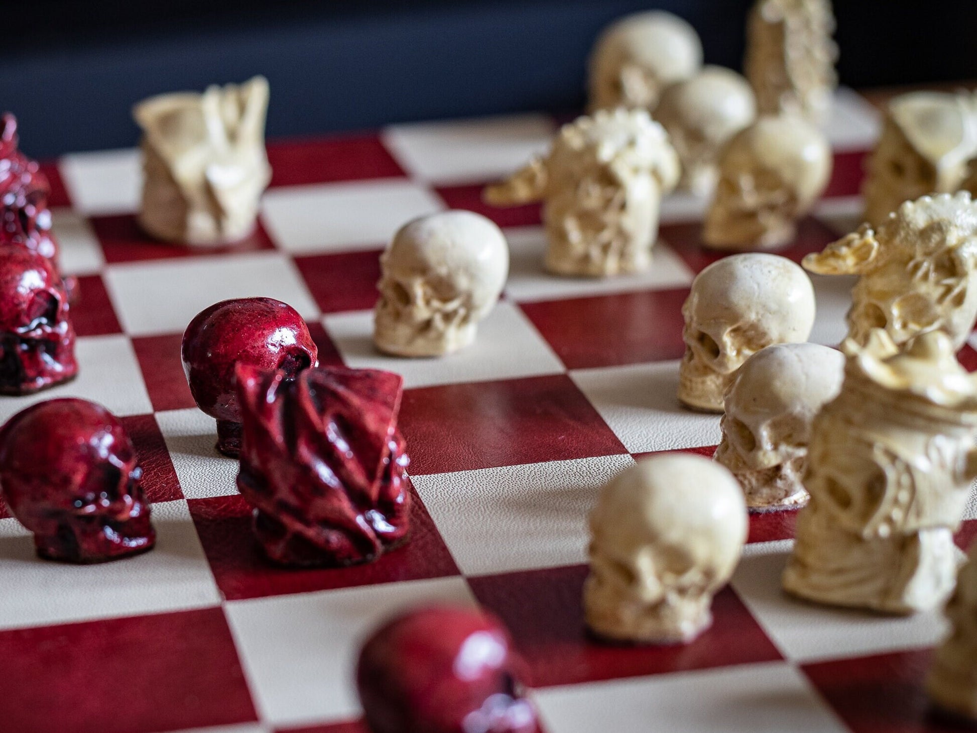 Made to order – Chess set, Skulls design in stone and aged red colour. BOARD NOT INCULDED