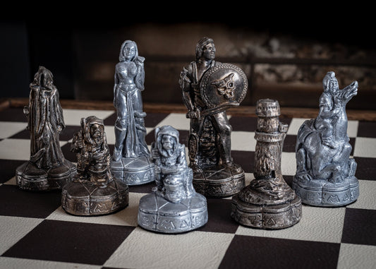 Chess set, Fantasy design in a distressed bronze and silver colour. BOARD NOT INCULDED