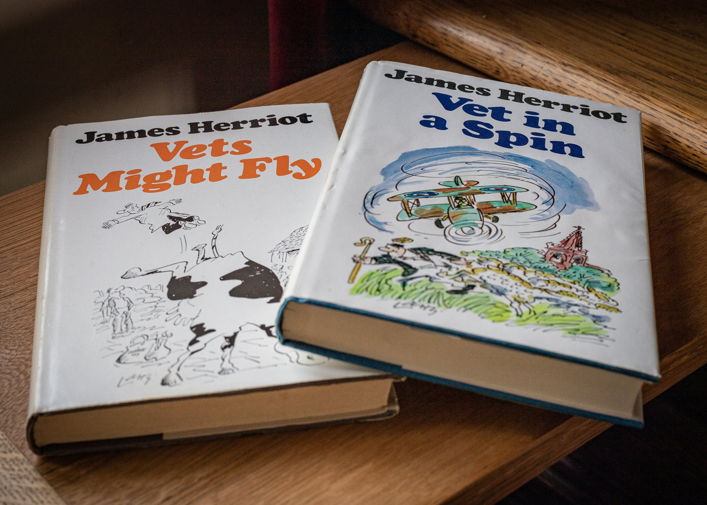 Two books by James Herriot, Vets Might Fly, 1977 and Vet in a spin, 1978.