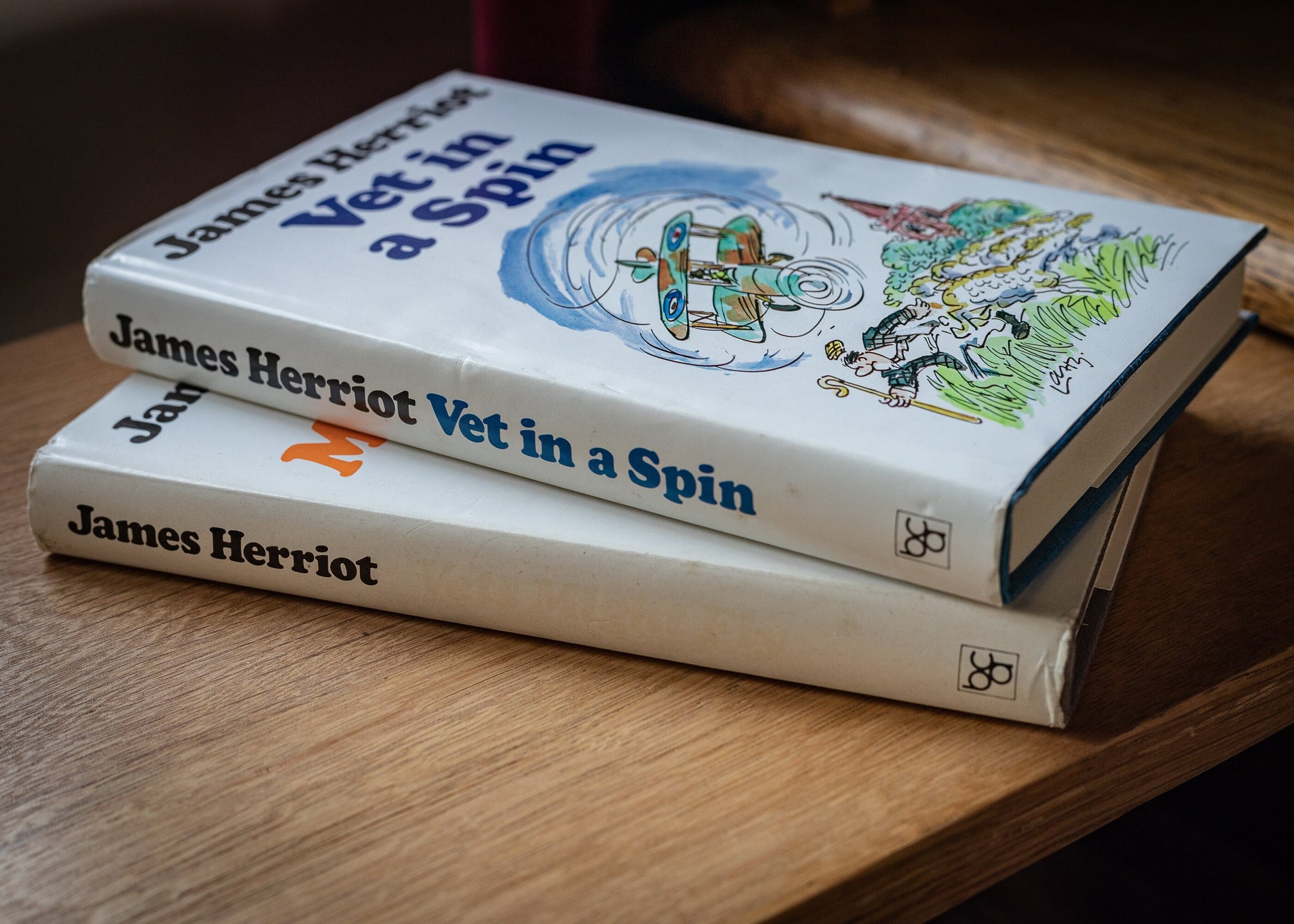 Two books by James Herriot, Vets Might Fly, 1977 and Vet in a spin, 1978.