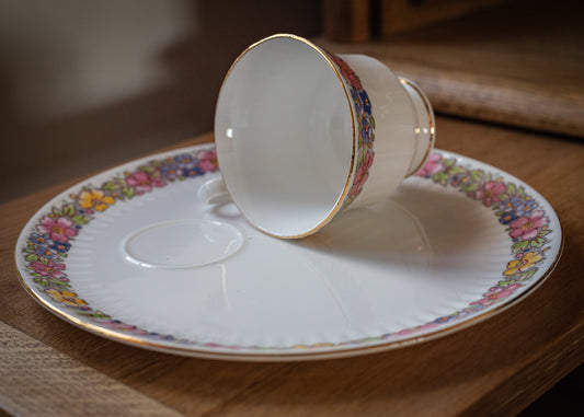 Dorchester Bone China cup and sandwich plate, in a floral pattern.