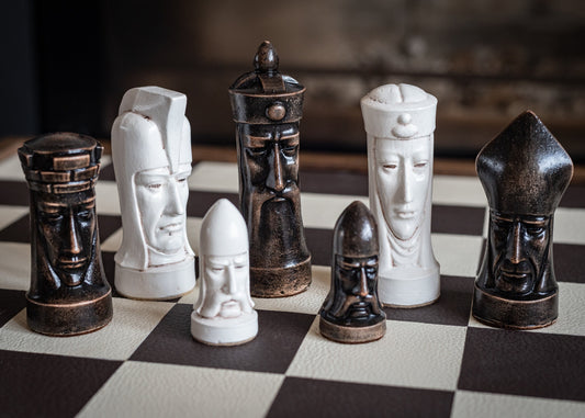 Chess set, Gothic heads design, similar to one used in orginal Star Trek series. In aged white and black. BOARD NOT INCULDED