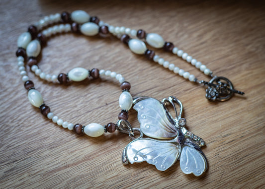 Mother of Pearl and Tiger eye necklance with Butterfly pendant.