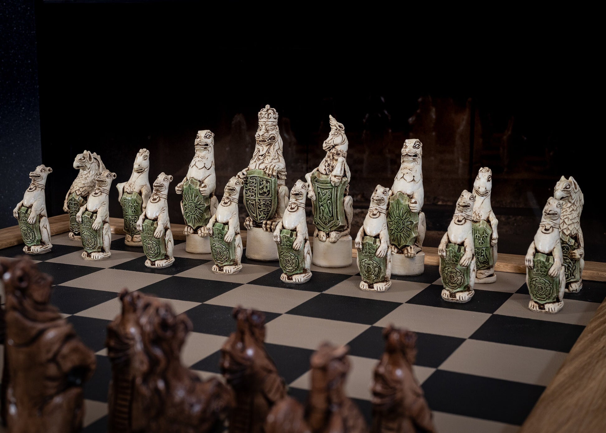 Chess set, Queen's or Royal Beasts, for Queen Elizabeth ii, in an aged ivory and dark oak colour. BOARD NOT INCULDED