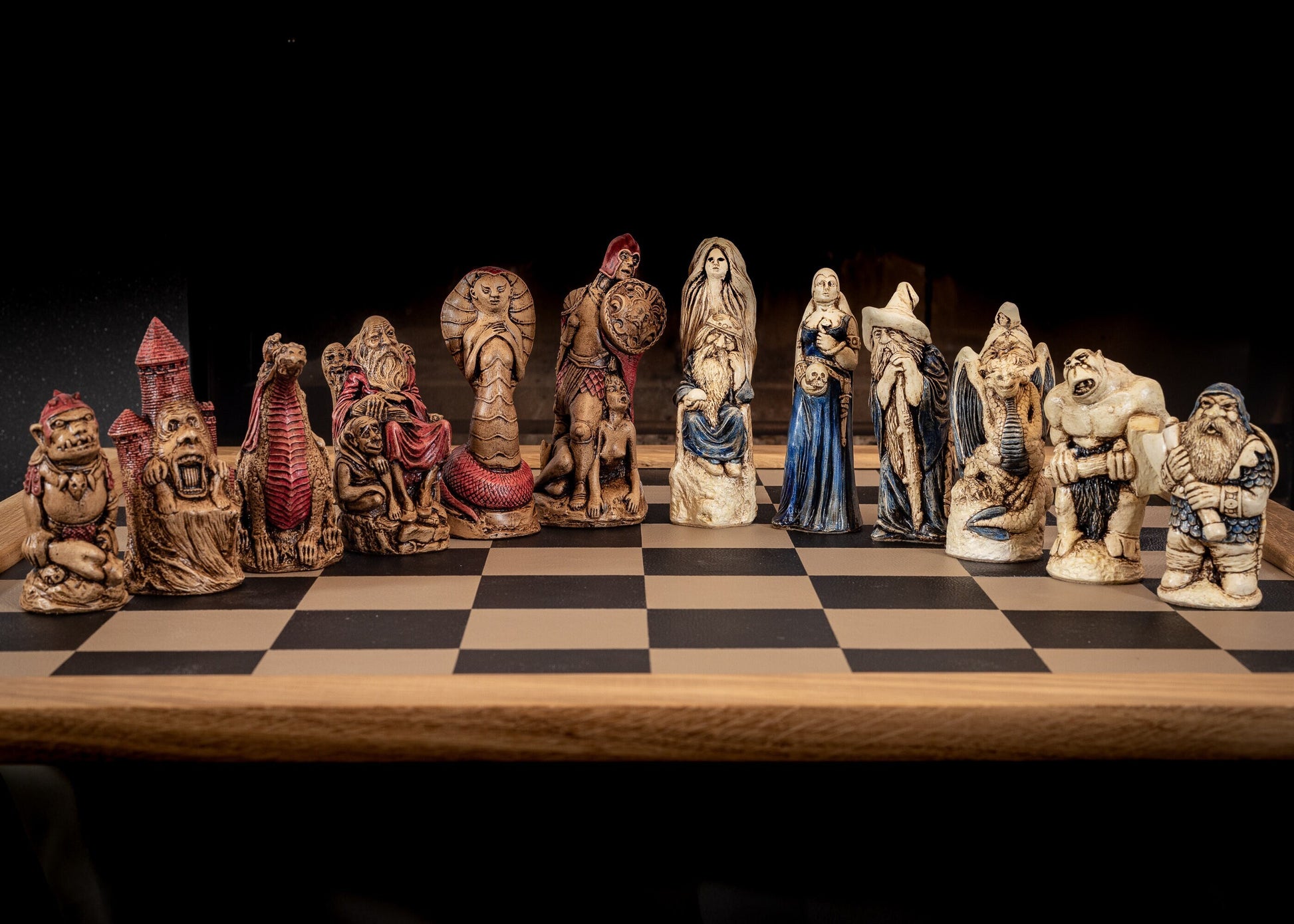 Made to order – Chess set, Spellmaster vs Cobra Queen, in aged ivory, with blue accents and walnut, with red accents. BOARD NOT INCULDED