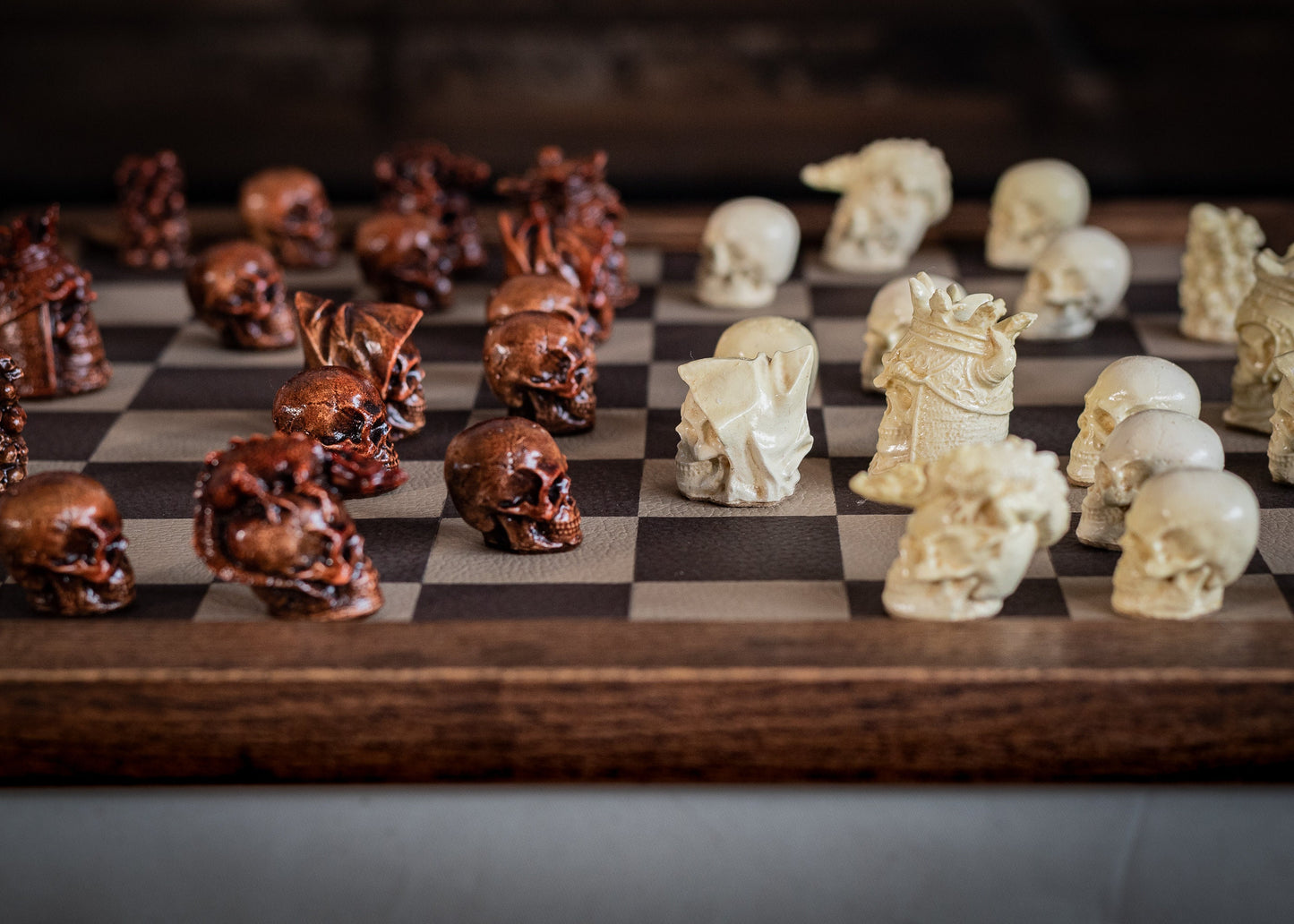 Made to order – Chess set, Skulls design in aged mahogany and stone. BOARD NOT INCULDED