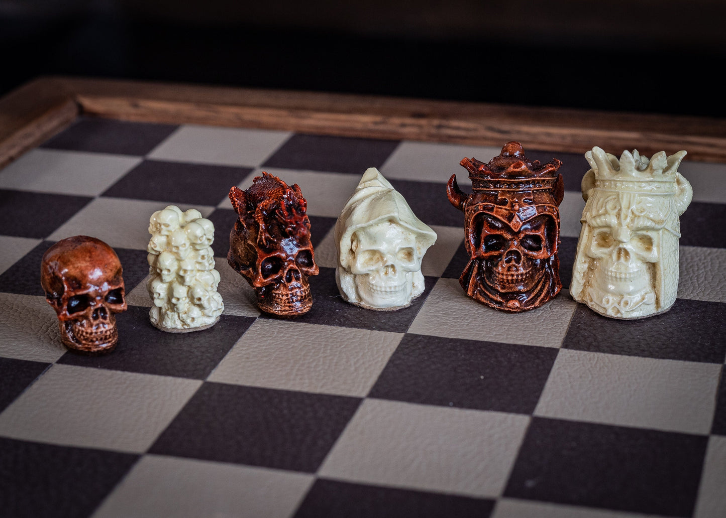 Made to order – Chess set, Skulls design in aged mahogany and stone. BOARD NOT INCULDED