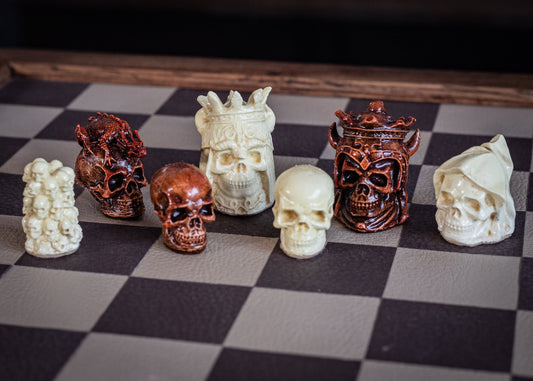 Made to order – Chess set, Skulls design in aged mahogany and stone. BOARD NOT INCULDED