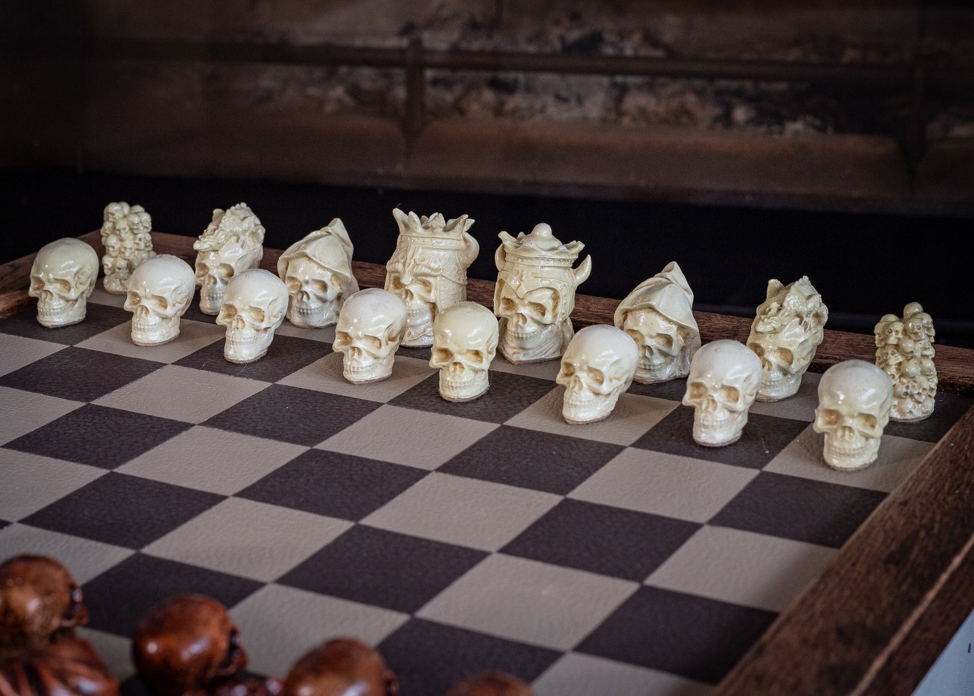 Made to order – Chess set, Skulls design in aged mahogany and stone. BOARD NOT INCULDED