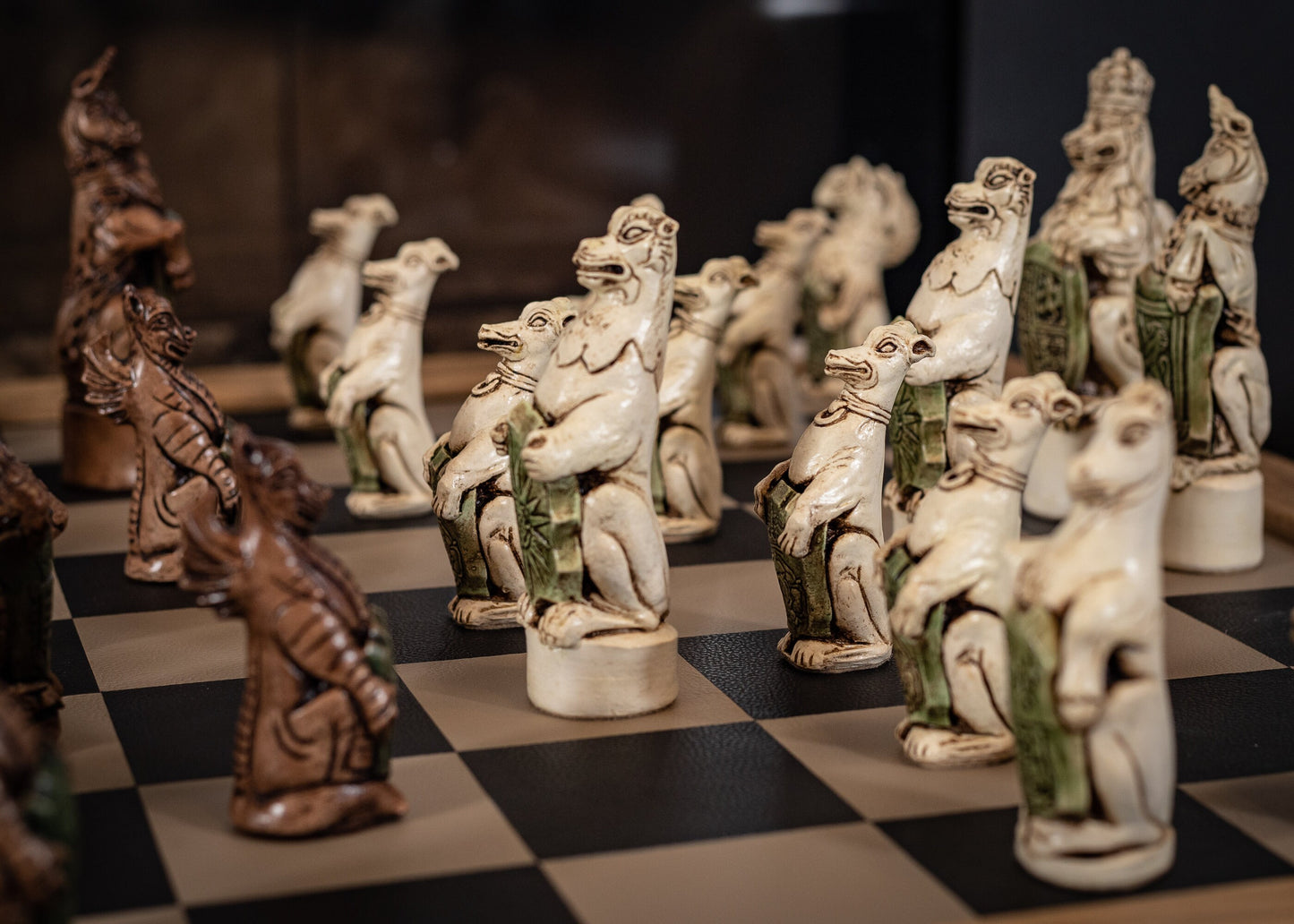 Chess set, Queen's or Royal Beasts, for Queen Elizabeth ii, in an aged ivory and dark oak colour. BOARD NOT INCULDED