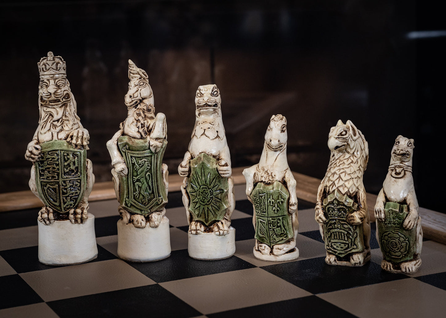 Chess set, Queen's or Royal Beasts, for Queen Elizabeth ii, in an aged ivory and dark oak colour. BOARD NOT INCULDED