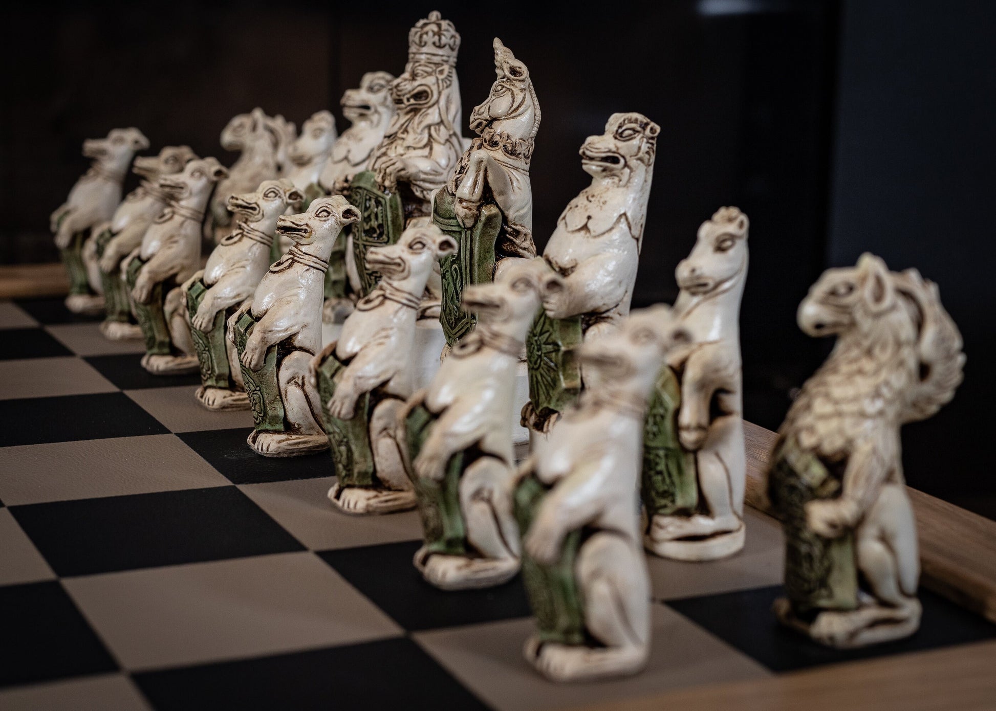 Chess set, Queen's or Royal Beasts, for Queen Elizabeth ii, in an aged ivory and dark oak colour. BOARD NOT INCULDED