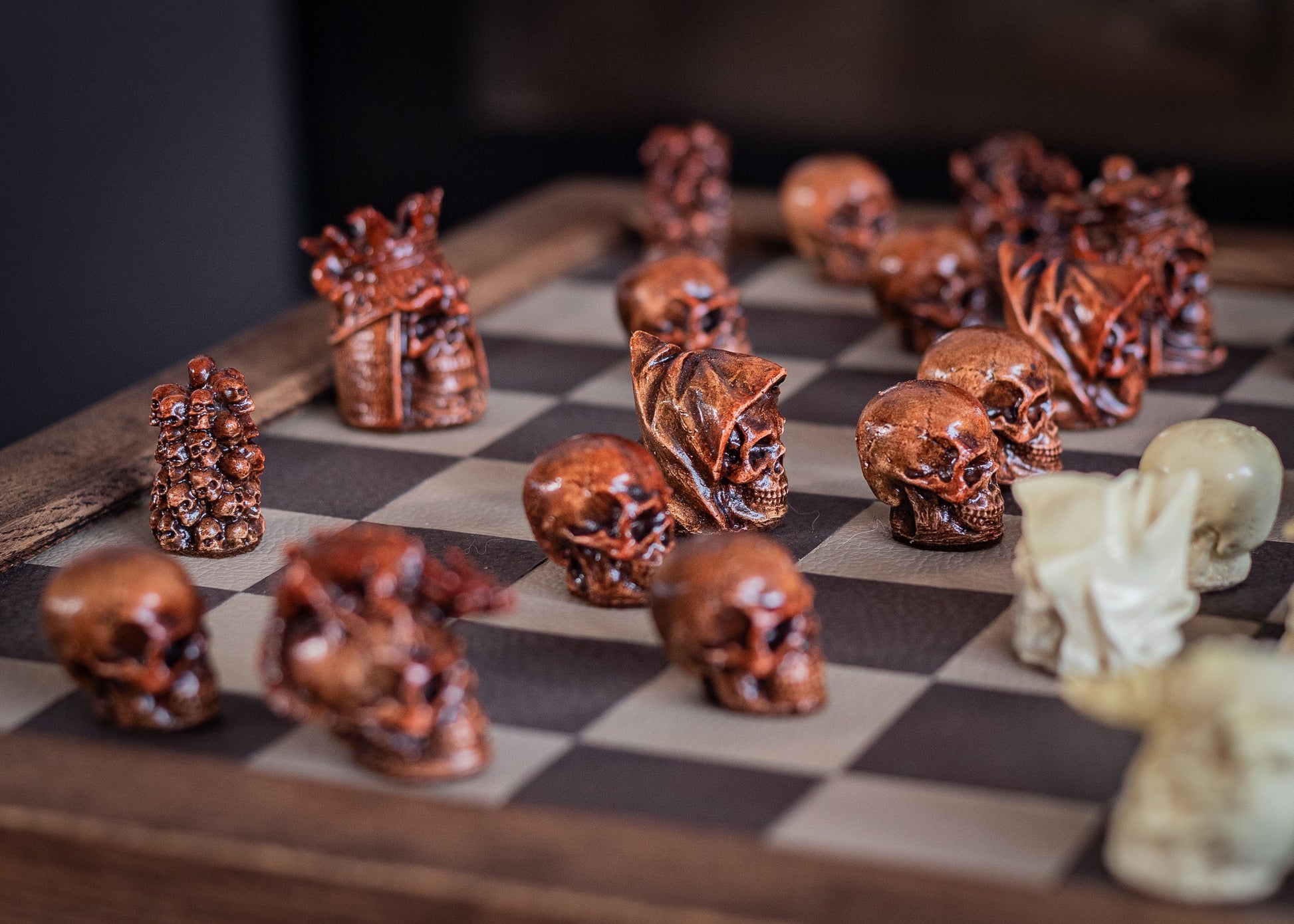 Made to order – Chess set, Skulls design in aged mahogany and stone. BOARD NOT INCULDED