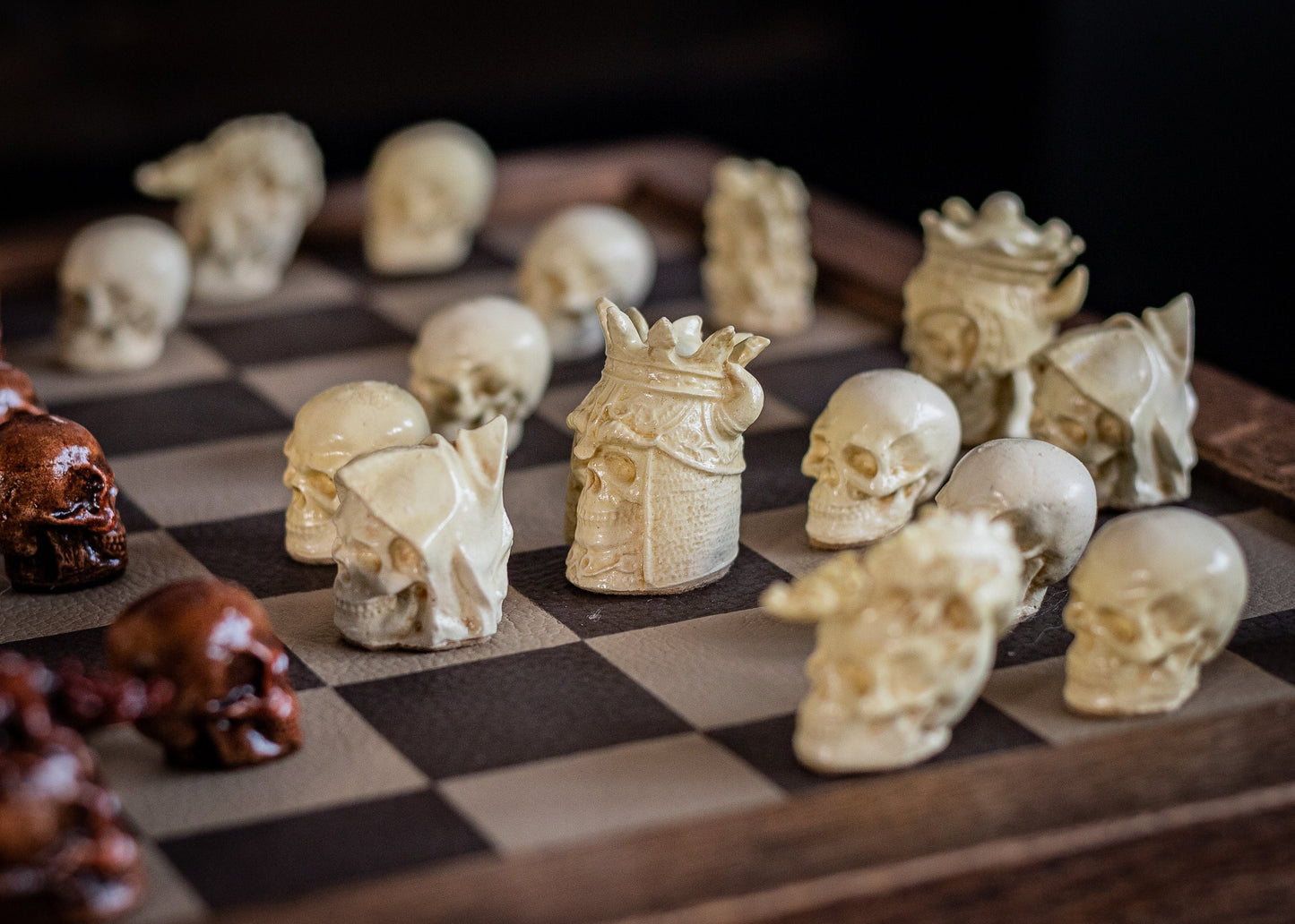 Made to order – Chess set, Skulls design in aged mahogany and stone. BOARD NOT INCULDED