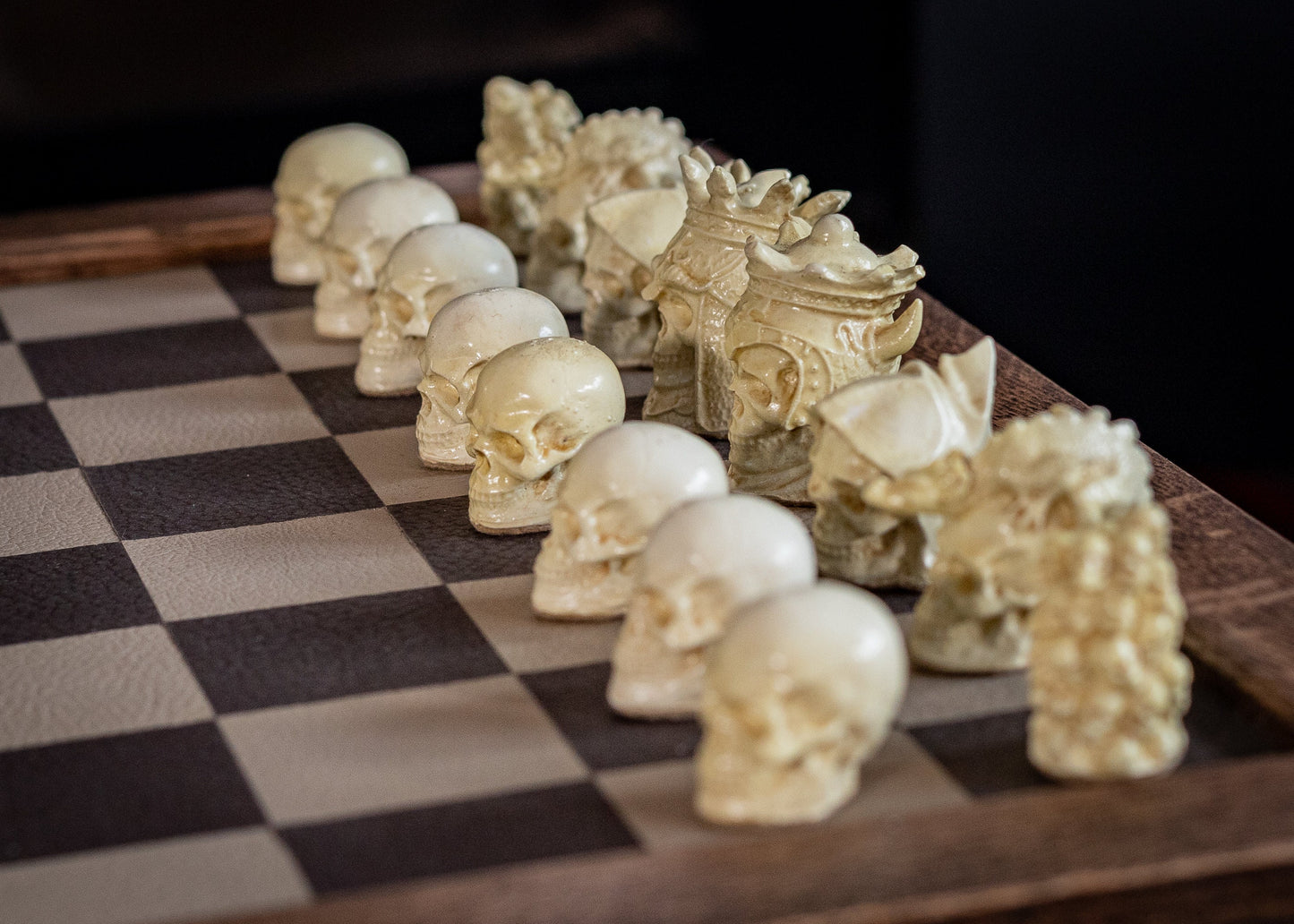 Made to order – Chess set, Skulls design in aged mahogany and stone. BOARD NOT INCULDED