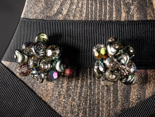 Vintage clip on earrings with multiple faceted beads in a cluster.