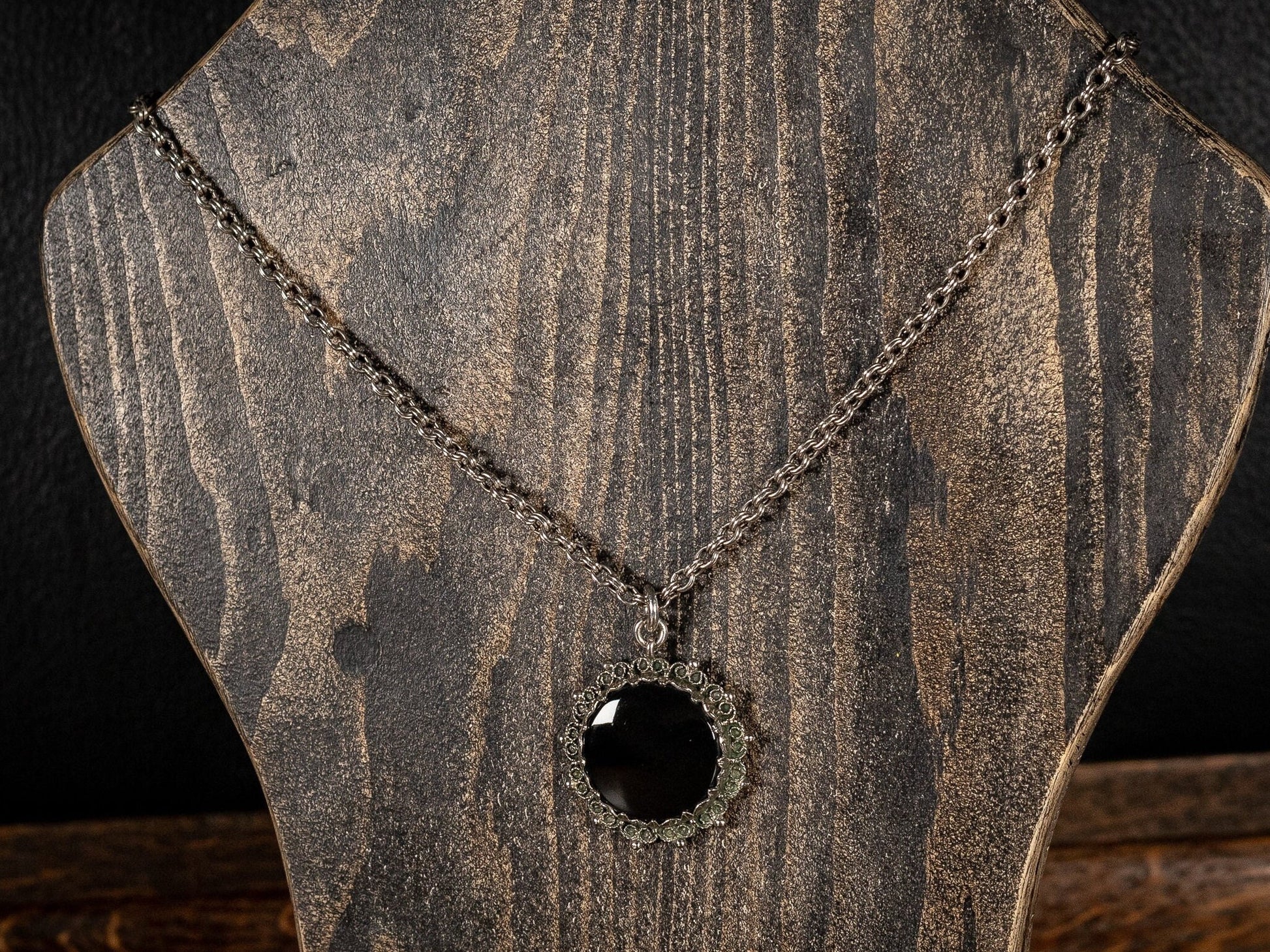 Silver necklace with round black gemstone pendant