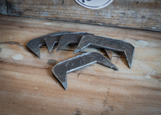 Vintage joiners/steel dogs, used for holding joints, while glue sets.