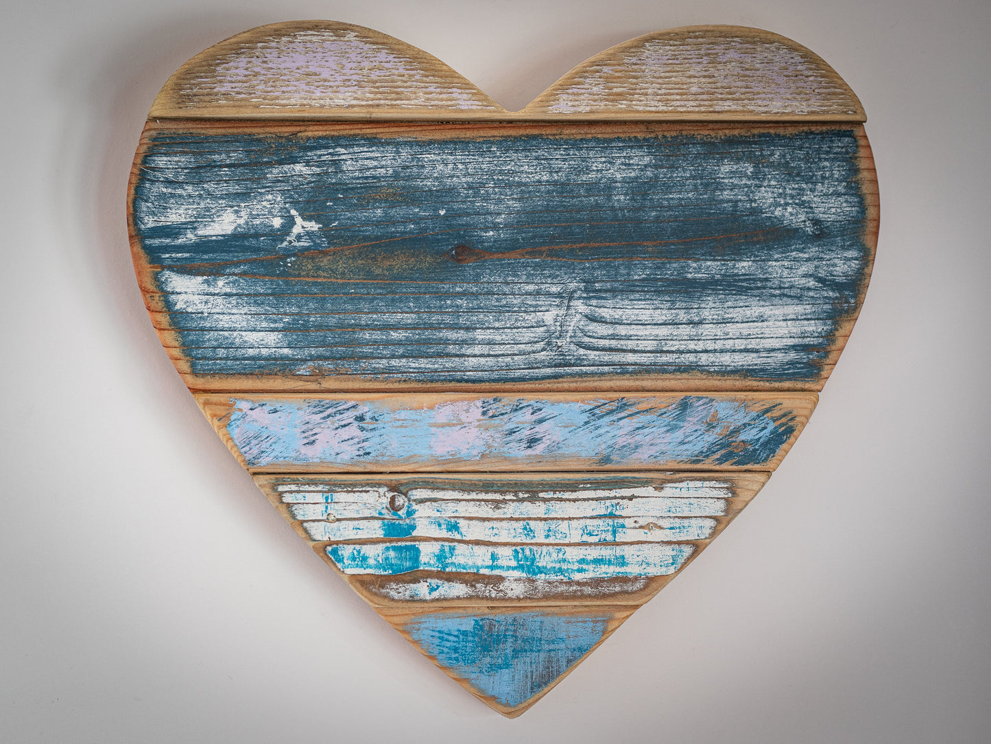 Rustic, painted, farmhouse style wooden hearts, for home decor or shop display.